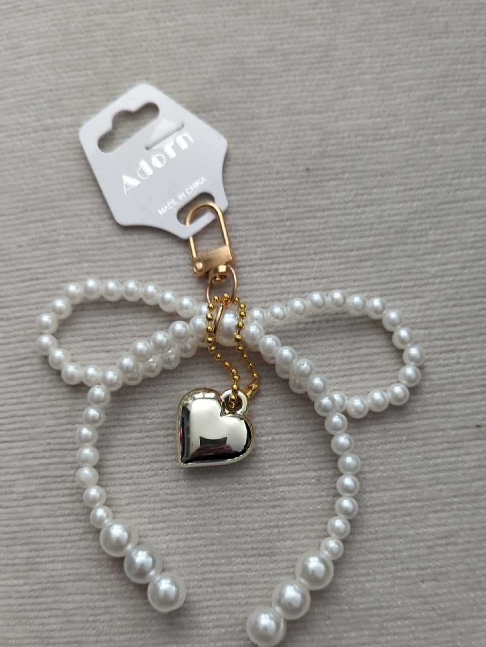 Adorn Pearl Bow Keychain with Gold Heart Charm
